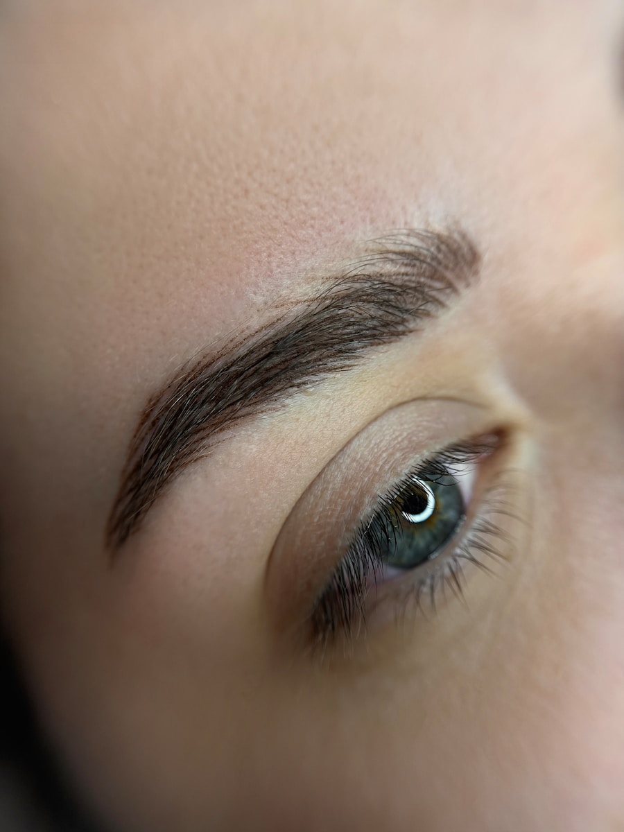 a close up of a person's eye with a pair of scissors